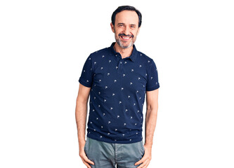 Fototapeta premium Middle age handsome man wearing casual polo looking positive and happy standing and smiling with a confident smile showing teeth