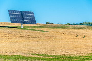 Lone solar panel in farm field