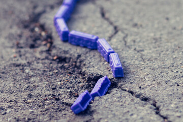 Toy train cars in the top view. Simulation of a railway accident and train wreck.