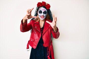 Woman wearing day of the dead costume over white shouting frustrated with rage, hands trying to strangle, yelling mad