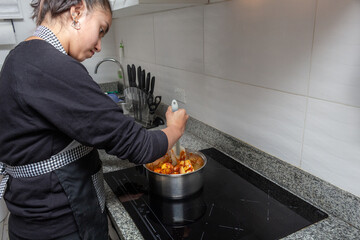 cooking cake in kitchen standing near desk