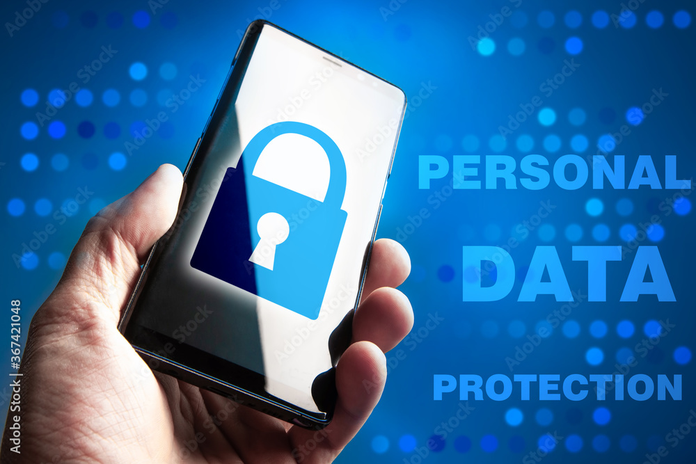 Poster the text of the personal data protection next to the smartphone. the smartphone screen shows a lock.