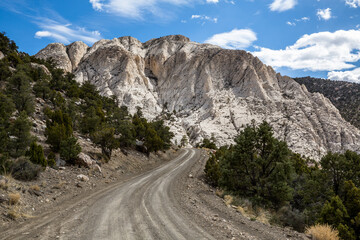 Summit of Crystal Peak over dirt road through the desert.