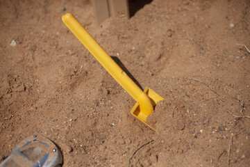 Children's shovel in the sandbox. 