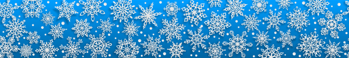 Christmas seamless banner of paper snowflakes with soft shadows on light blue background. With horizontal repetition