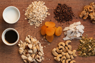 Granola ingredients in a wood table. Muesli ingredients. Top view