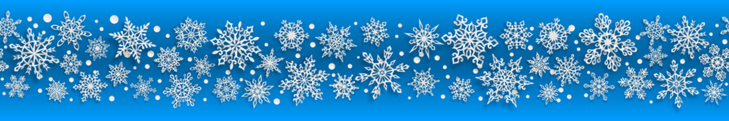 Christmas seamless banner of paper snowflakes with soft shadows on light blue background. With horizontal repetition