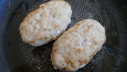 fried chicken cutlets in a pan