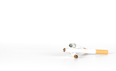burning cigarette on white background with copy space.