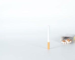 cigarette with package on behind isolated on white background. concept for illness, narcotic.