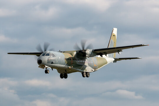 Twin Engined Camouflaged Military Cargo Airplane On Approach To Land.