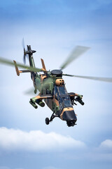 Camouflaged army attack helicopter.