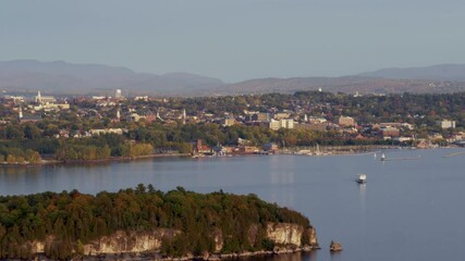 Aerial of Burlington, VT and Camels Hump, ferry crossing Lake Champlain, telephoto pan