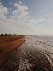 People on the beach in the evening sun