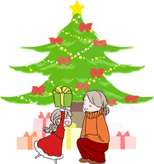 クリスマスプレゼントをもらって喜ぶ女の子と母親