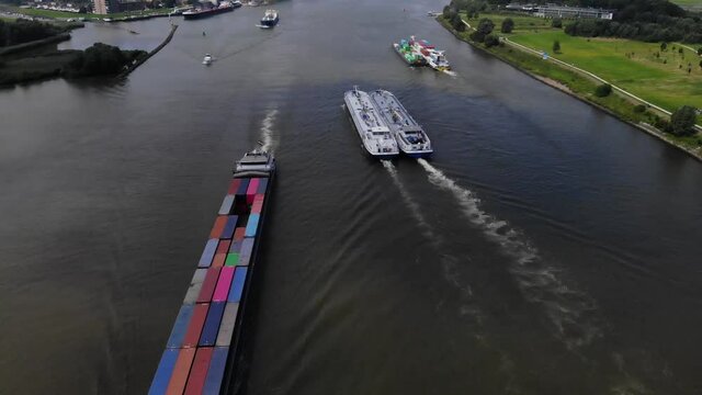 transportation barges sailing on dutch river