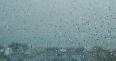 Heavy raining outside, rain on the window glass
