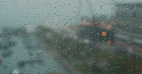 Heavy raining outside, rain on the window glass