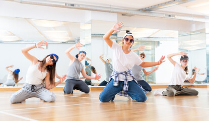 Fototapeta premium Boy and girls having dancing class in dance studio