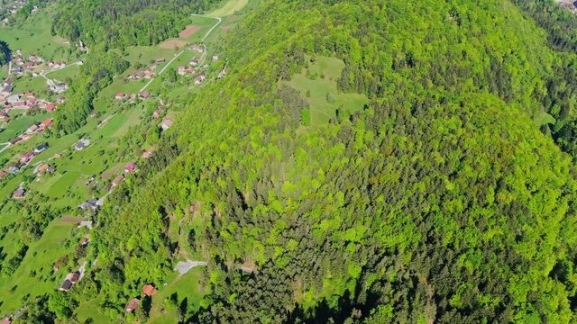 Lake Velenje with TES Power Station in background. Aerial tilt up