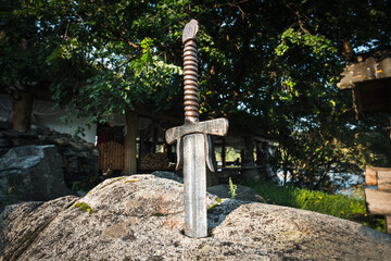 Excalibur, King Arthur's sword in stone. Edged weapons from the legend Pro king Arthur.