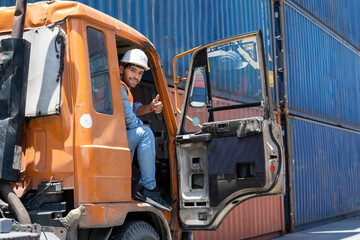 Foreman show thumb up signal working at Container cargo harbor, Business Logistics import export shipping concept.