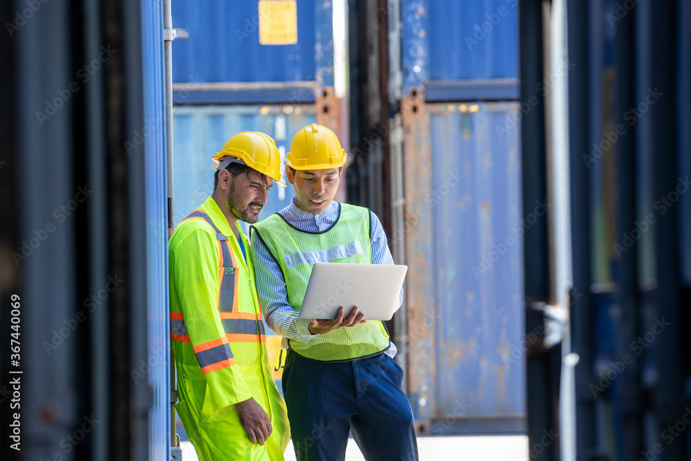 Poster two foreman workers discussing and checking in shipping yard at container cargo.