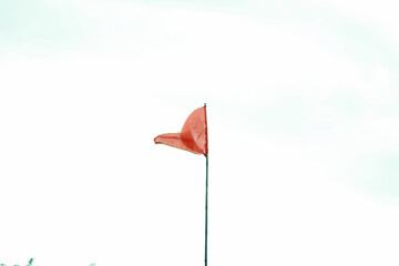 Wavy Orange Silk Flag isolated on white background