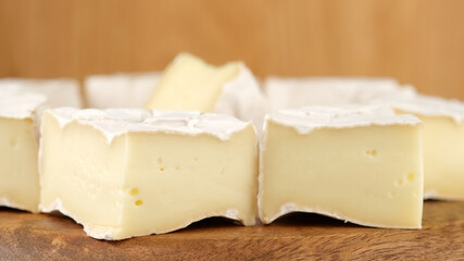 Fototapeta na wymiar cheese Camembert Delicious pieces of white mold cheeses with soft textures Camembert close up