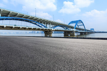 Asphalt road and viaduct with river in hangzhou,China.