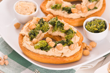 Friselle with turnip tops and hummus.
