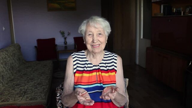 The flexible nylon dentures in senior female hands. Dental concept