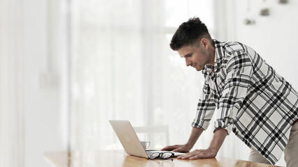young man working on laptop