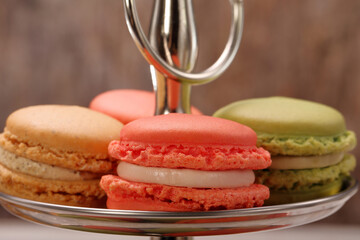 Sweet colorful macaroons on a metal plate
