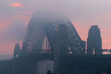 Fototapeta na wymiar Close-up view of fog covering Sydney Harbour Bridge.