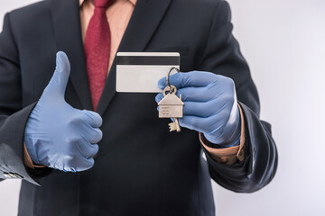 Businessman in period pandemic sale house. Safety for all