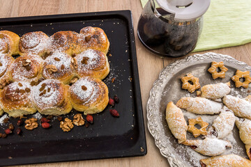 delicious homemade cakes sprinkled icing with coffee on the table for breakfast