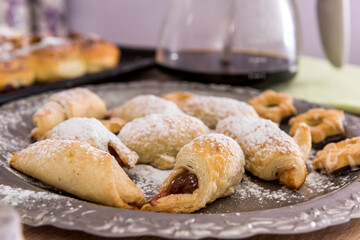 Fototapeta na wymiar delicious homemade cakes sprinkled icing with coffee on the table for breakfast