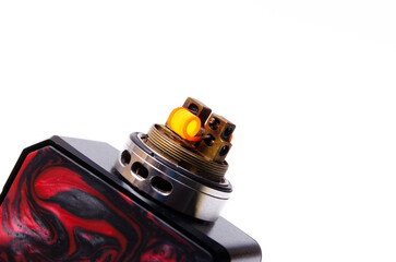 Voopoo drag 2 with Pnp Tank and tank with coils. Hot, red vape coils. Refueling steam in close-up...