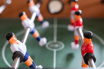 close up of  players in table football soccer game