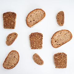 Pieces of different bread on a white background. Pattern.