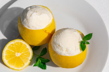 Homemade italian Sorbetto al limone or  Lemon sorbet. Decorated with mint. Top view. From above....