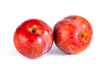 Red plums isolated on the white background
