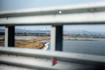 The road to Crimea via the Crimean bridge. View from the car window on the Kerch Bay. Coastal strip of the sea and gulls