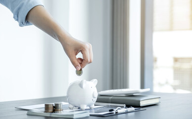 Woman putting coin into piggy bank, step up start up business to suscess, Saving money for future plan and retirement fund concept