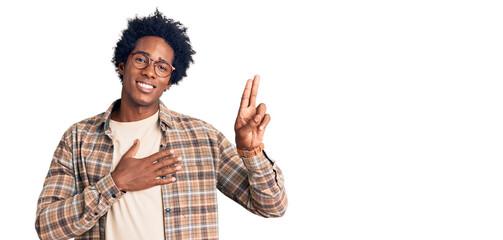 Handsome african american man with afro hair wearing casual clothes and glasses smiling swearing...