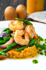 Macro photo of ingredients of salad with shrimp, green bean, roasted onion and green buckwheat
