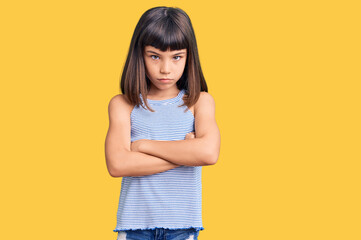 Young little girl with bang wearing casual clothes skeptic and nervous, disapproving expression on face with crossed arms. negative person.