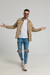 young unshaved man opening arms and welcoming