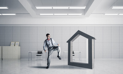 Fototapeta premium Stone home as symbol for real estate insurance in modern interior